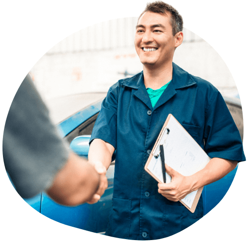 business marketing a business owner smiling and shaking hands with a customer